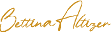 Cursive gold signature on a transparent background.