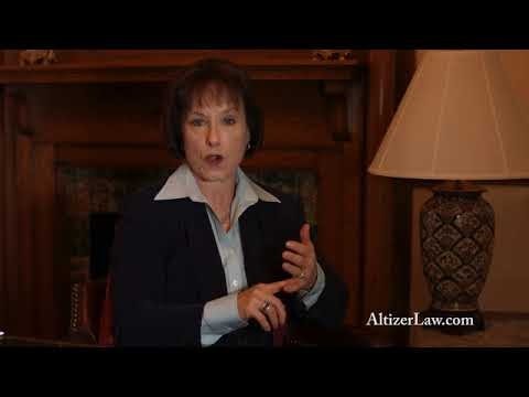 Woman in a suit speaking indoors next to a lamp and a wooden mantle, with "AltizerLaw.com" text visible on the image.